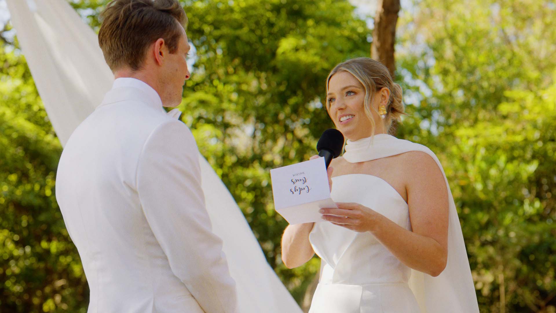 Bride and groom during an outdoor wedding ceremony