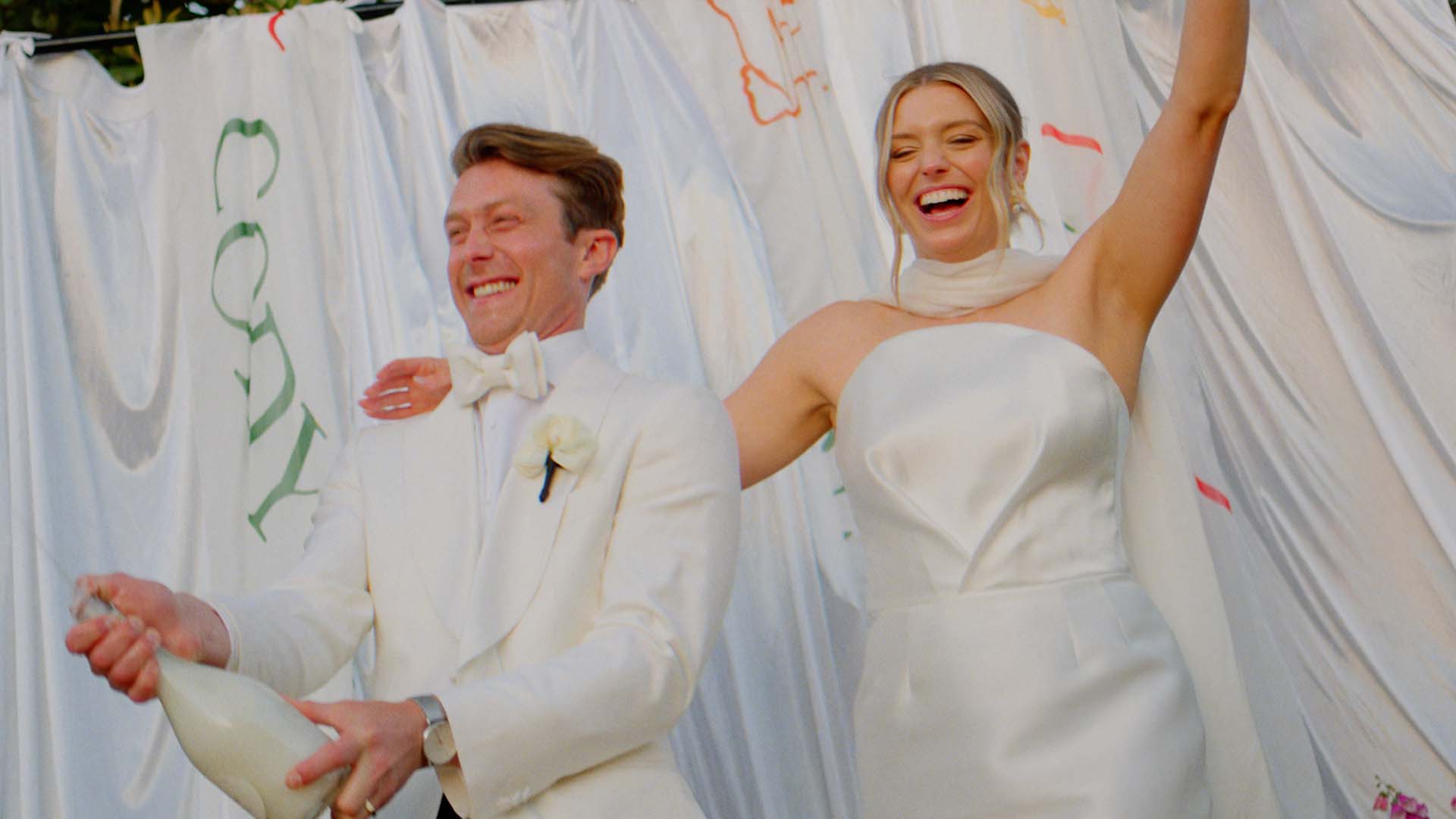 A bride and groom during their wedding ceremony, filmed by Sea of Love